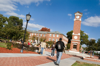 students walking on campus; clock tower; Blair Hall building